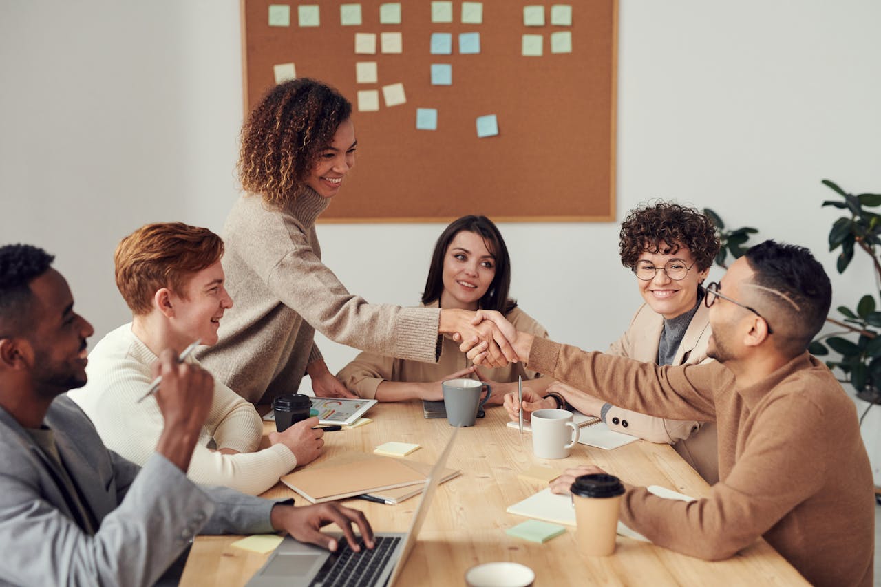 why-choose-us Diverse team collaborating in a meeting, showcasing teamwork and cooperation in a modern workplace.
